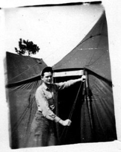 Kay D. Call in front of WWII tent